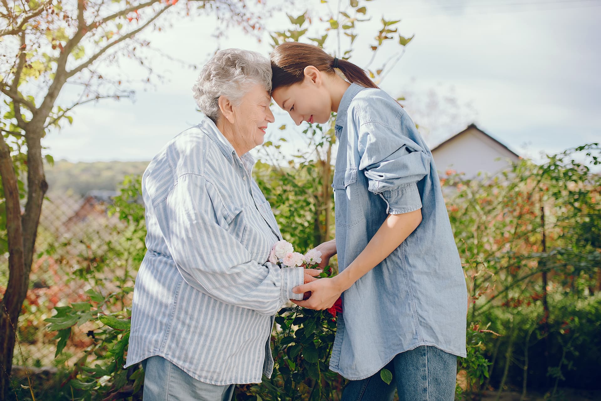 old-woman-garden-with-young-granddaughter